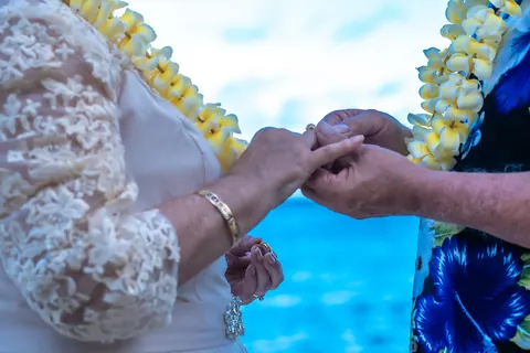 Close up of their hands joined during the vows