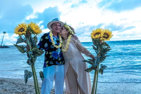 Daniel and Shirley between the two sunflower stands