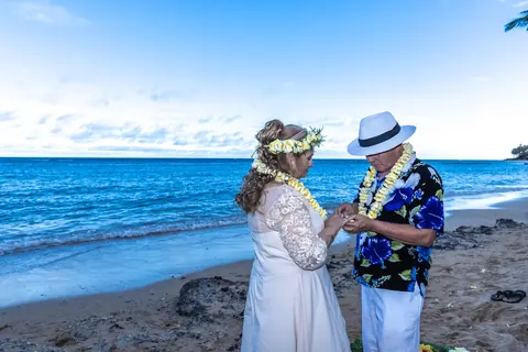 Daniel and Shirley on the beach as the sun goes down