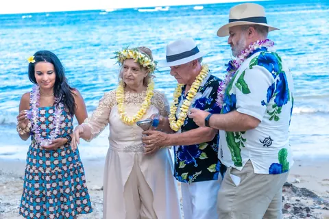 Daniel and Shirley with family in leis