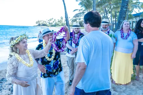 Family and friends gathered in leis