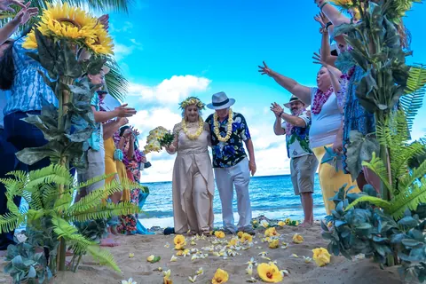 Family gathered beside the sunflowers and petal walkway