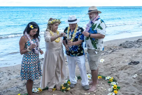 Family with the couple by the sea