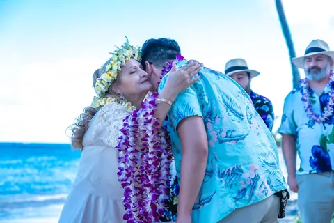 Hugs and leis on the beach