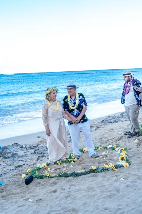 The ceremony on the sand with the ocean behind