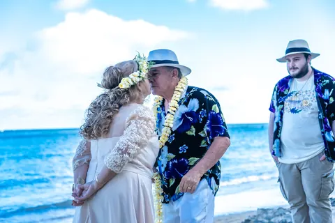 The couple with the minister by the water