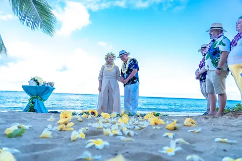 The turquoise pedestal and yellow petals on the sand
