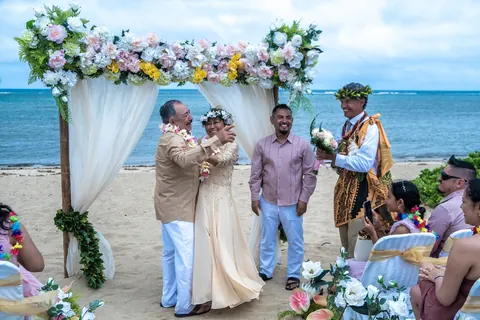 Family gathered around the arch during the ceremony