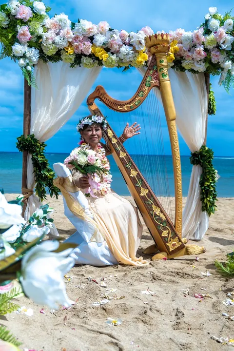 The golden harp with white orchids in the foreground