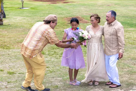 A granddaughter in lavender with the couple in the park