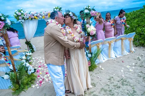 Guests in lavender watching the vows from the aisle