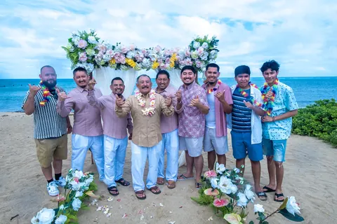 The men of the family with the couple