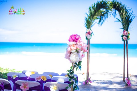 Palm archway with flowers on the beach at Waimanalo