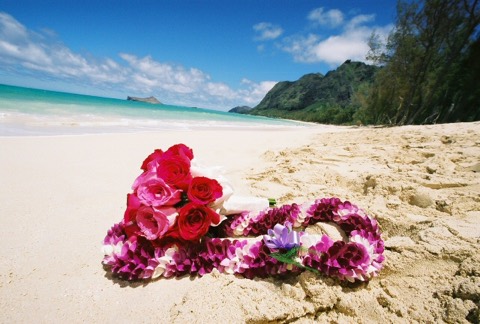 Flower leis for the bride on the sand at Waimanalo