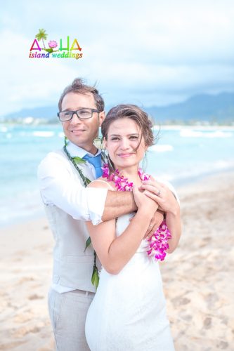 N&J beach wedding Carlos holding his briide for a photo on the beach