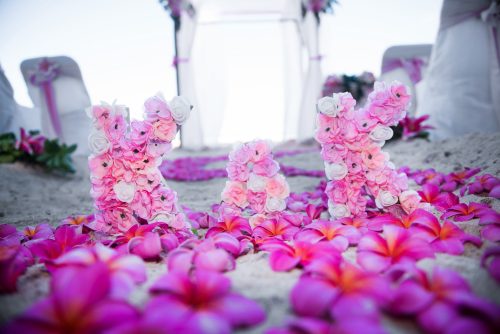 Wedding flower initials on the sand at Waimanalo beach park